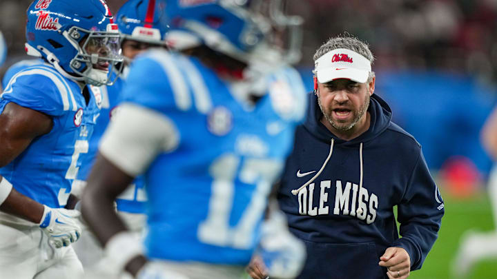 Ole Miss head coach Pete Golding runs off the field during warmups before the CFP Fiesta Bowl at the State Farm Stadium, in Glendale, Ariz., on Thursday, Jan. 8, 2026.