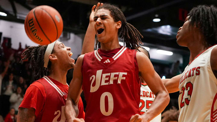 Jeffersonville Red Devils Tre Singleton (0) celebrates scoring against the Lawrence North Wildcats, Saturday, March 16, 2024, during the IHSAA Class 4A semistate game at New Castle High School in Newcastle, Indiana. The Jeffersonville Red Devils defeated the Lawrence North Wildcats, 62-60.
