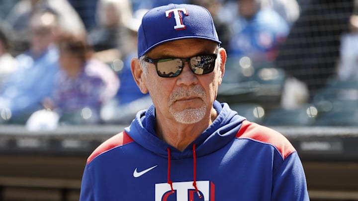 May 24, 2025; Chicago, Illinois, USA; Texas Rangers manager Bruce Bochy (15) looks on from the dugout before a baseball game against the Chicago White Sox at Rate Field