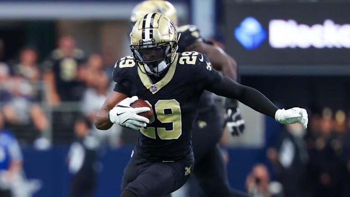 Sep 15, 2024; Arlington, Texas, USA;  New Orleans Saints cornerback Paulson Adebo (29) intercepts a ball intended for Dallas Cowboys wide receiver Jalen Brooks (not pictured) during the first half at AT&T Stadium. Mandatory Credit: Kevin Jairaj-Imagn Images