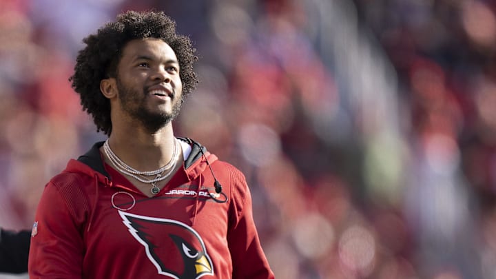 Murray smiles on the sidelines of an Arizona Cardinals game.