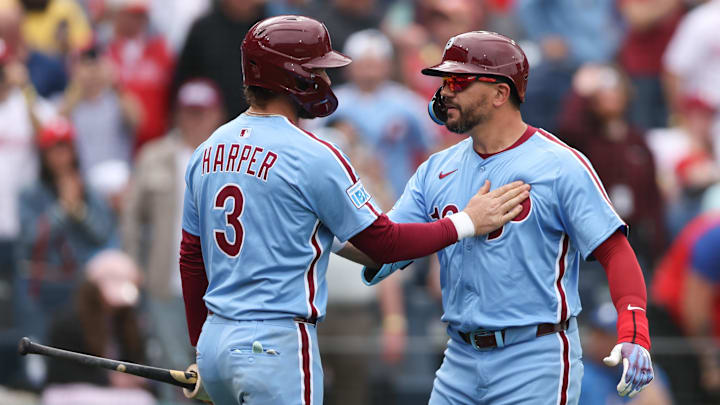 Philadelphia Phillies designated hitter Kyle Schwarber (12) celebrates his home run with first baseman Bryce Harper (3) against the Colorado Rockies at Citizens Bank Park.