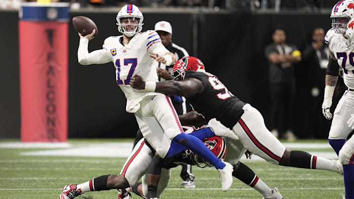 Oct 13, 2025; Atlanta, Georgia, USA; Atlanta Falcons defensive tackle David Onyemata (90) and defensive tackleSam Roberts (99) applie the pressure on Buffalo Bills quarterback Josh Allen (17) who is looking to show downfield during the second half of a game at Mercedes-Benz Stadium. Mandatory Credit: Dale Zanine-Imagn Images