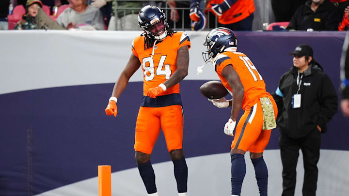 Nov 17, 2024; Denver, Colorado, USA; Denver Broncos wide receiver Lil'Jordan Humphrey (84) celebrates his touchdown with wide receiver Marvin Mims Jr. (19) in the second half against the Atlanta Falcons at Empower Field at Mile High. Mandatory Credit: Ron Chenoy-Imagn Images