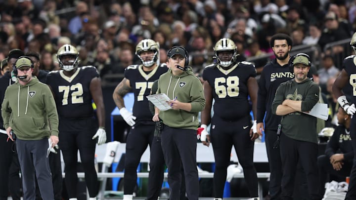 Oct 26, 2025; New Orleans, Louisiana, USA; New Orleans Saints head coach Kellen Moore stands on the sidelines during the second quarter against the Tampa Bay Buccaneers at Caesars Superdome. Mandatory Credit: Stephen Lew-Imagn Images Oct 26, 2025; New Orleans, Louisiana, USA; New Orleans Saints head coach Kellen Moore stands on the sidelines during the second quarter against the Tampa Bay Buccaneers at Caesars Superdome. Mandatory Credit: Stephen Lew-Imagn Images