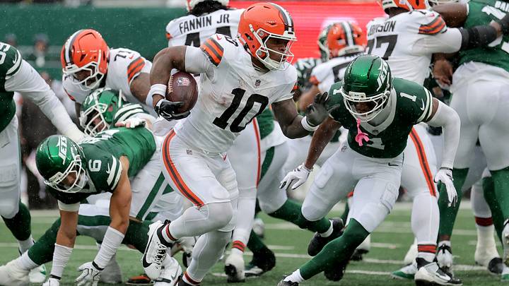 Oct 11, 2026; East Rutherford, New Jersey, USA; Cleveland Browns running back Quinshon Judkins (10) runs with the ball against New York Jets cornerback Azareye'h Thomas (1) during the first quarter at MetLife Stadium. Mandatory Credit: Brad Penner-Imagn Images
