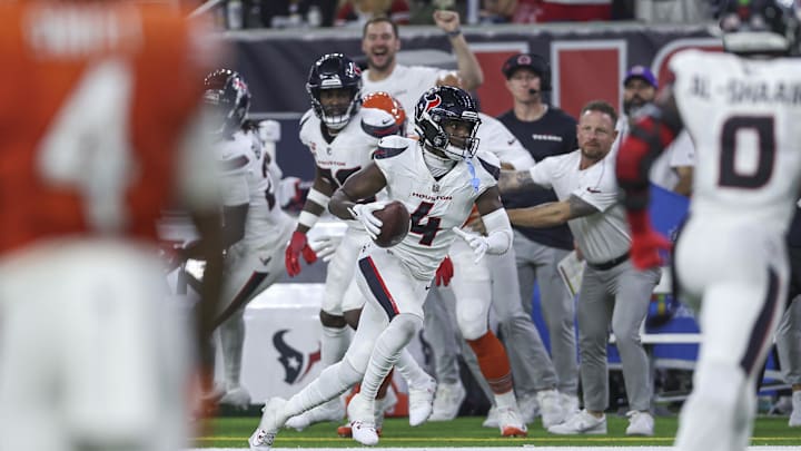 Houston Texans cornerback Kamari Lassiter (4) runs with the ball after an interception against the Chicago Bears.