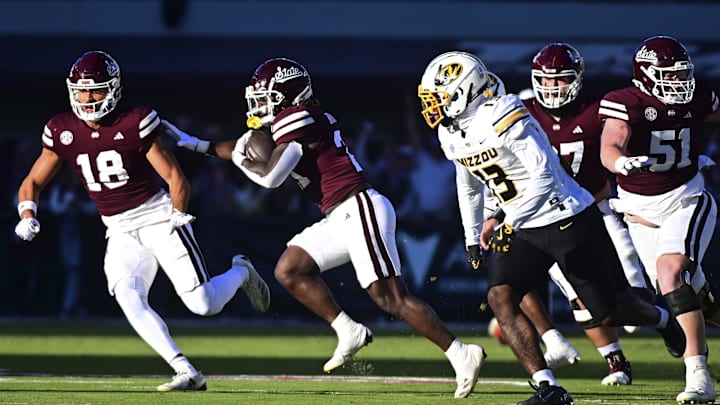 Nov 23, 2024; Starkville, Mississippi, USA; Mississippi State Bulldogs running back Davon Booth (21) runs against the Missouri Tigers during the first quarter at Davis Wade Stadium at Scott Field. Mandatory Credit: Matt Bush-Imagn Images