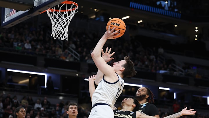 Mar 24, 2024; Indianapolis, IN, USA; Marquette Golden Eagles guard Tyler Kolek (11) shoots over the defense against Colorado in the second round of the NCAA Tournament.