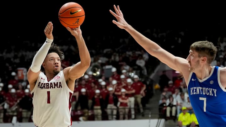 Feb 22, 2025; Tuscaloosa, AL, USA; Alabama guard Mark Sears (1) shoots a three over Kentucky forward Andrew Carr (7) at Coleman Coliseum. Alabama defeated Kentucky 96-83. Sears scored 30 points for Alabama. Mandatory Credit: Gary Cosby Jr.-Tuscaloosa News