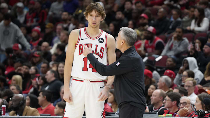 Oct 12, 2024; Chicago, Illinois, USA; Chicago Bulls head coach Billy Donovan talks with Chicago Bulls forward Matas Buzelis (14) during the first half at United Center. Mandatory Credit: David Banks-Imagn Images