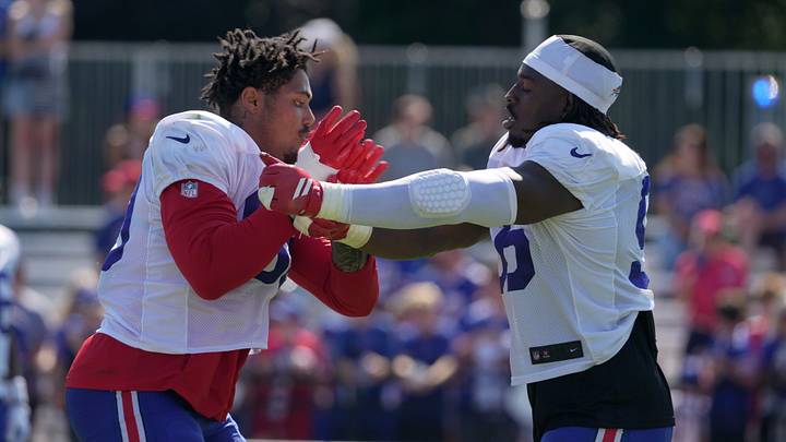 The Buffalo Bills' T.J. Parker gets a few extra drills in after practice with Javon Solomon at Bills Training Camp at St. John Fisher University in Pittsford on Aug. 4, 2026.