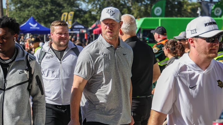 Nov 22, 2025; Orlando, Florida, USA; UCF Knights head coach Scott Frost walks into the venue before the game against the Oklahoma State Cowboys at Acrisure Bounce House. Mandatory Credit: Mike Watters-Imagn Images