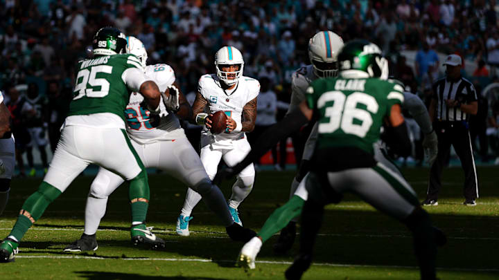 Dec 8, 2024; Miami Gardens, Florida, USA; Miami Dolphins quarterback Tua Tagovailoa (1) drops back with the ball during the second half against the New York Jets at Hard Rock Stadium.