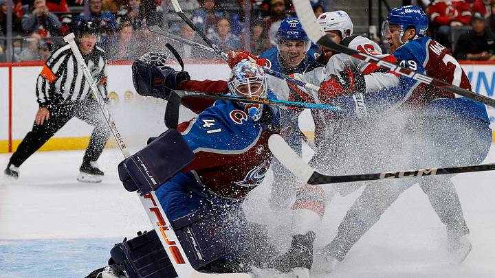 Oct 28, 2025; Denver, Colorado, USA; Colorado Avalanche goaltender Scott Wedgewood (41) deflects the puck under pressure from New Jersey Devils right wing Connor Brown (16) as center Nathan MacKinnon (29) and defenseman Sam Malinski (70) defend in the third period at Ball Arena. Mandatory Credit: Isaiah J. Downing-Imagn Images Oct 28, 2025; Denver, Colorado, USA; Colorado Avalanche goaltender Scott Wedgewood (41) deflects the puck under pressure from New Jersey Devils right wing Connor Brown (16) as center Nathan MacKinnon (29) and defenseman Sam Malinski (70) defend in the third period at Ball Arena. Mandatory Credit: Isaiah J. Downing-Imagn Images