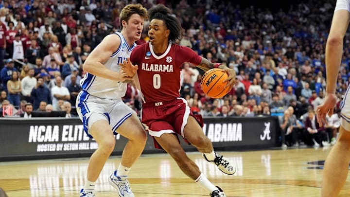Mar 29, 2025; Newark, NJ, USA; Alabama Crimson Tide guard Labaron Philon (0) drives to the basket against Duke Blue Devils guard Kon Knueppel (7) during the first half in the East Regional final of the 2025 NCAA tournament at Prudential Center. Mar 29, 2025; Newark, NJ, USA; Alabama Crimson Tide guard Labaron Philon (0) drives to the basket against Duke Blue Devils guard Kon Knueppel (7) during the first half in the East Regional final of the 2025 NCAA tournament at Prudential Center.
