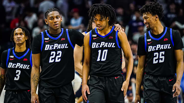 Jan 2, 2024; Storrs, Connecticut, USA; DePaul Blue Demons guard Elijah Fisher (22), guard Jaden Henley (10), forward Jeremiah Oden (25) and guard Jalen Terry (3) return up court against the Connecticut Huskies in the second half at Harry A. Gampel Pavilion. Mandatory Credit: David Butler II-Imagn Images