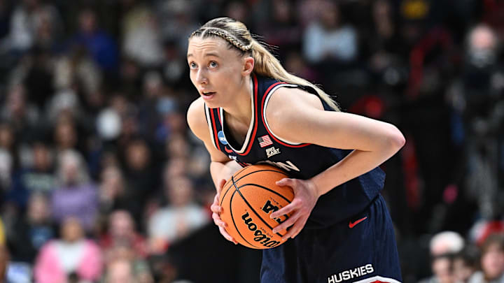 Mar 31, 2025; Spokane, WA, USA; UConn Huskies guard Paige Bueckers (5) controls the ball against the USC Trojans during the first half of a Elite 8 NCAA Tournament basketball game at Spokane Arena. Mandatory Credit: James Snook-Imagn Images Mar 31, 2025; Spokane, WA, USA; UConn Huskies guard Paige Bueckers (5) controls the ball against the USC Trojans during the first half of a Elite 8 NCAA Tournament basketball game at Spokane Arena. Mandatory Credit: James Snook-Imagn Images