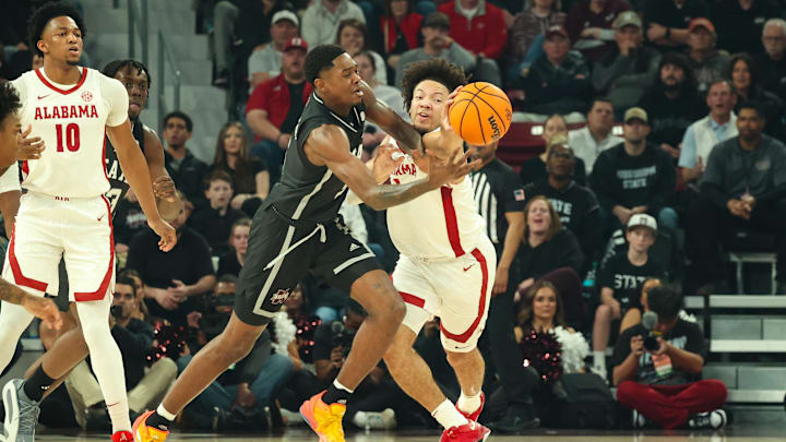 Jan 29, 2025; Starkville, Mississippi, USA; Mississippi State Bulldogs guard Shawn Jones Jr. (5) and Alabama Crimson Tide guard Mark Sears (1) reach for a loose ball during the first half at Humphrey Coliseum. Mandatory Credit: Wesley Hale-Imagn Images Jan 29, 2025; Starkville, Mississippi, USA; Mississippi State Bulldogs guard Shawn Jones Jr. (5) and Alabama Crimson Tide guard Mark Sears (1) reach for a loose ball during the first half at Humphrey Coliseum. Mandatory Credit: Wesley Hale-Imagn Images