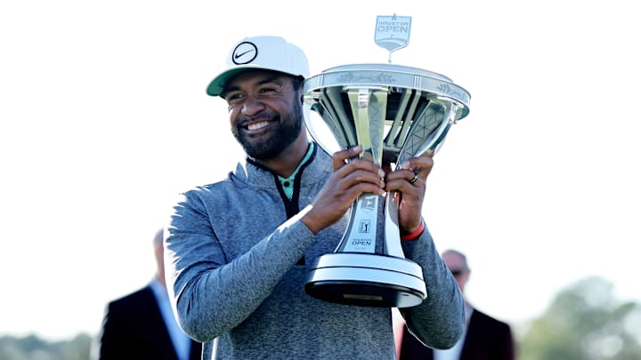Nov 13, 2022; Houston, Texas, USA; Tony Finau raises the championship trophy after winning the