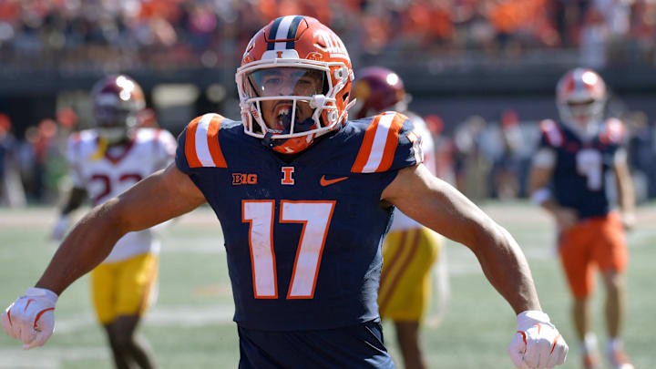 Sep 27, 2025; Champaign, Illinois, USA;  Illinois Fighting Illini wide receiver Collin Dixon (17) reacts after a catch and run during the second half against the Southern California Trojans at Memorial Stadium. Mandatory Credit: Ron Johnson-Imagn Images