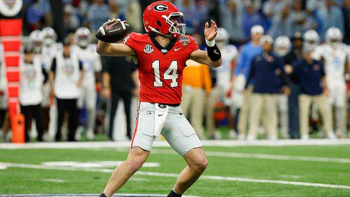 Jan 1, 2026; New Orleans, LA, USA; Georgia Bulldogs quarterback Gunner Stockton (14) passes the ball against the Mississippi Rebels in the first quarter during the 2026 Sugar Bowl and quarterfinal game of the College Football Playoff at Caesars Superdome. Mandatory Credit: Geoff Burke-Imagn Images Jan 1, 2026; New Orleans, LA, USA; Georgia Bulldogs quarterback Gunner Stockton (14) passes the ball against the Mississippi Rebels in the first quarter during the 2026 Sugar Bowl and quarterfinal game of the College Football Playoff at Caesars Superdome. Mandatory Credit: Geoff Burke-Imagn Images