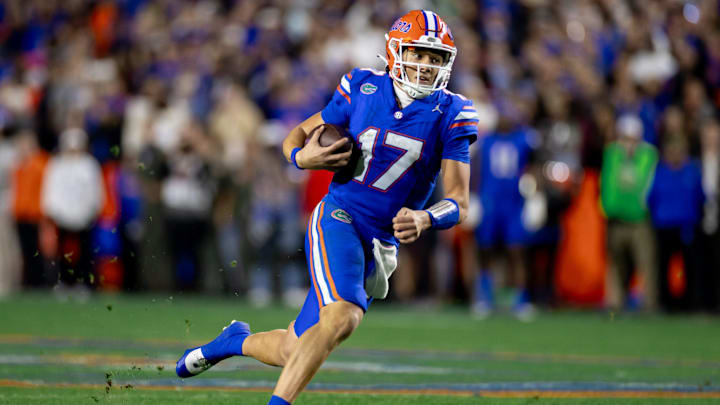 Florida Gators quarterback Max Brown (17) rushes with the ball during the second half against the Florida State Seminoles at Steve Spurrier Field at Ben Hill Griffin Stadium in Gainesville, FL on Saturday, November 25, 2023. [Matt Pendleton/Gainesville Sun]