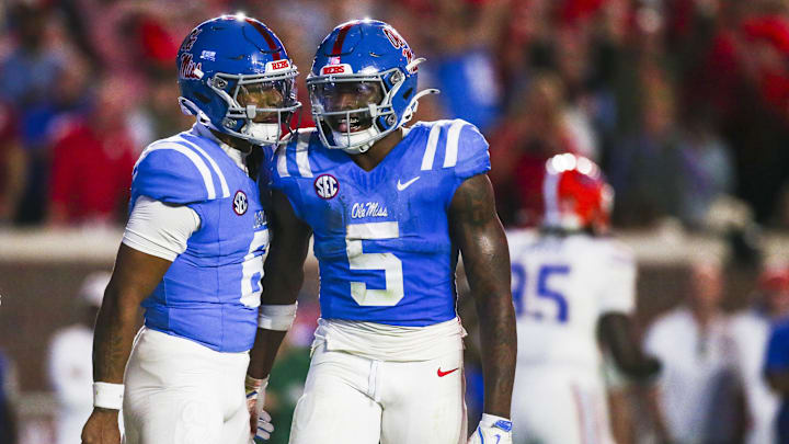 Nov 15, 2025; Oxford, Mississippi, USA; Mississippi Rebels running back Kewan Lacy (5) celebrates with quarterback Trinidad Chambliss (6) after rushing for a touchdown against the Florida Gators during the first quarter at Vaught-Hemingway Stadium. Mandatory Credit: Petre Thomas-Imagn Images