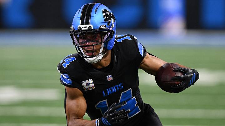 Detroit Lions wide receiver Amon-Ra St. Brown (14) runs the ball 