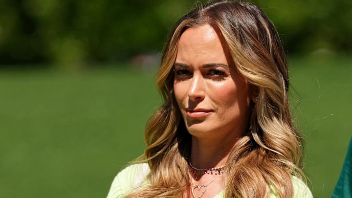 Apr 9, 2023; Augusta, Georgia, USA; Jena Sims, wife of Brooks Koepka (not pictured) watches from the fourth hole during the final round of The Masters golf tournament.