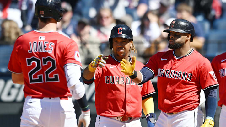 Apr 27, 2025; Cleveland, Ohio, USA; Cleveland Guardians right fielder Nolan Jones (22) celebrates with designated hitter Jose Ramirez (11) and first baseman Carlos Santana (41) after hitting a three-run home run during the sixth inning against the Boston Red Sox at Progressive Field. Mandatory Credit: Ken Blaze-Imagn Images