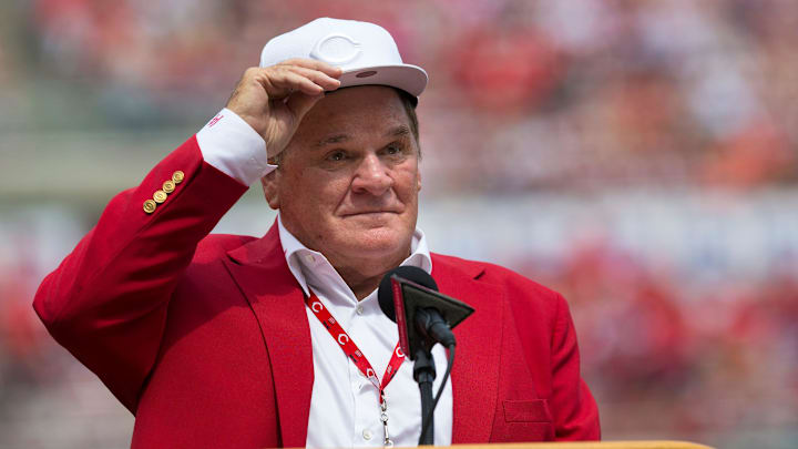 An emotional Cincinnati Reds hall of famer Pete Rose adjusts his cap as he takes the microphone during a pregame ceremony for the unveiling of Pete Rose's bronze statue being installed outside the stadium before the MLB National League game between the Cincinnati Reds and the Los Angeles Dodgers at Great American Ball Park in downtown Cincinnati on Saturday, June 17, 2017.
