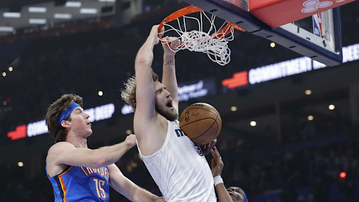 Dec 22, 2025; Oklahoma City, Oklahoma, USA; Memphis Grizzlies center Jock Landale (31) dunks against the Oklahoma City Thunder during the first quarter at Paycom Center. Mandatory Credit: Alonzo Adams-Imagn Images