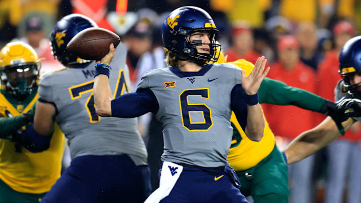 Garrett Greene #6 of the West Virginia Mountaineers passes down field against the Baylor Bears during the first half at McLane Stadium on November 25, 2023 in Waco, Texas.