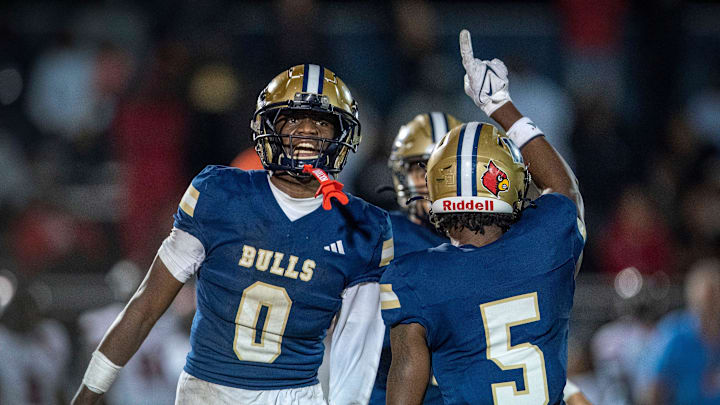West Boca's Damon Allen, left, and Jaydin Broadnax celebrate a stop against Miami Southridge in the state semifinal game on December 6, 2024, in Boca Raton, Florida.