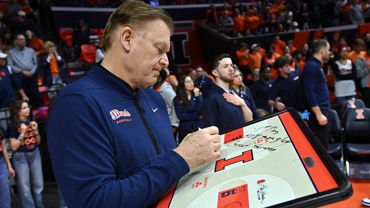 Mar 3, 2026; Champaign, Illinois, USA;  Illinois Fighting Illini head coach Brad Underwood works on his game plan before the first half against the Oregon Ducks at State Farm Center. Mandatory Credit: Ron Johnson-Imagn Images