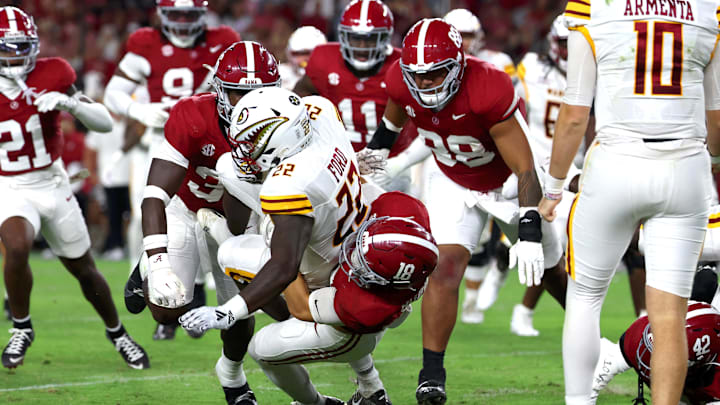 Sep 6, 2025; Tuscaloosa, Alabama, USA; Louisiana Monroe Warhawks running back D'Shaun Ford (22) is tackled by Alabama Crimson Tide defensive back Bray Hubbard (18) during the second half at Saban Field at Bryant-Denny Stadium.