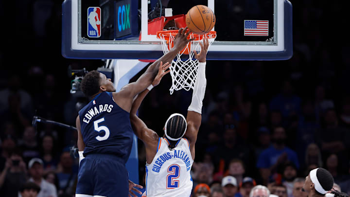 Minnesota Timberwolves guard Anthony Edwards (5) blocks a shot by Oklahoma City Thunder guard Shai Gilgeous-Alexander during the second half at Paycom Center in Oklahoma City on Feb. 24, 2025.