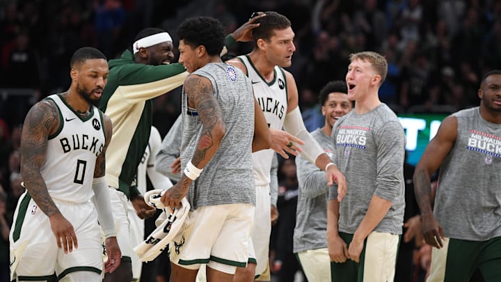 Nov 8, 2023; Milwaukee, Wisconsin, USA; Milwaukee Bucks forward Bobby Portis (9) celebrates a three-point shot by Milwaukee Bucks center Brook Lopez (11) in the second half against Detroit Pistons at Fiserv Forum. Mandatory Credit: Michael McLoone-Imagn Images