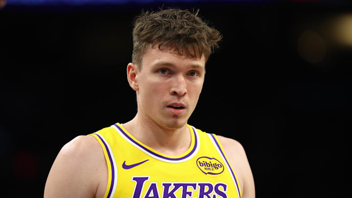 Dec 23, 2025; Phoenix, Arizona, USA; Los Angeles Lakers forward Dalton Knecht (4) against the Phoenix Suns at Mortgage Matchup Center. Mandatory Credit: Mark J. Rebilas-Imagn Images