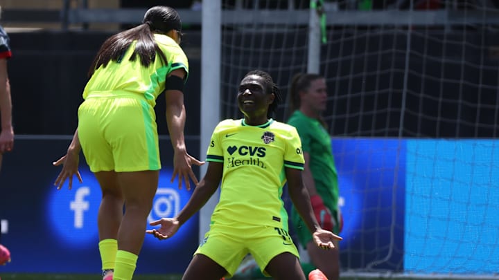 Washington Spirit forward Rosemonde Kouassi (right) scored in a 3–2 win over Chicago.
