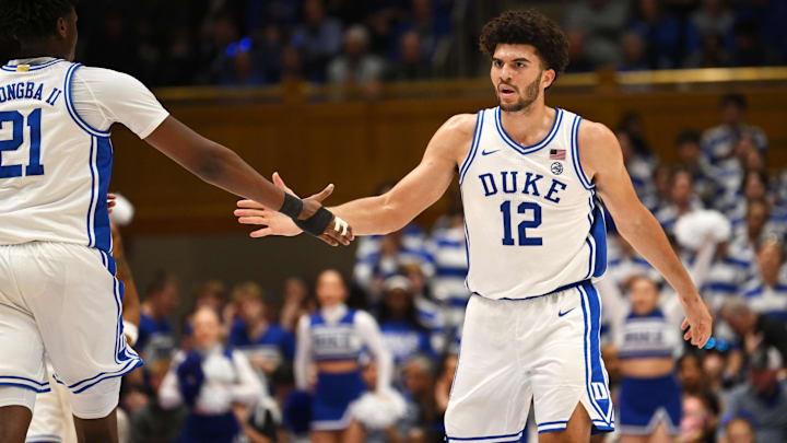Feb 16, 2026; Durham, North Carolina, USA;  Duke Blue Devils forward Cameron Boozer (12) celebrates with center Patrick Ngongba II (21) against the Syracuse Orange.