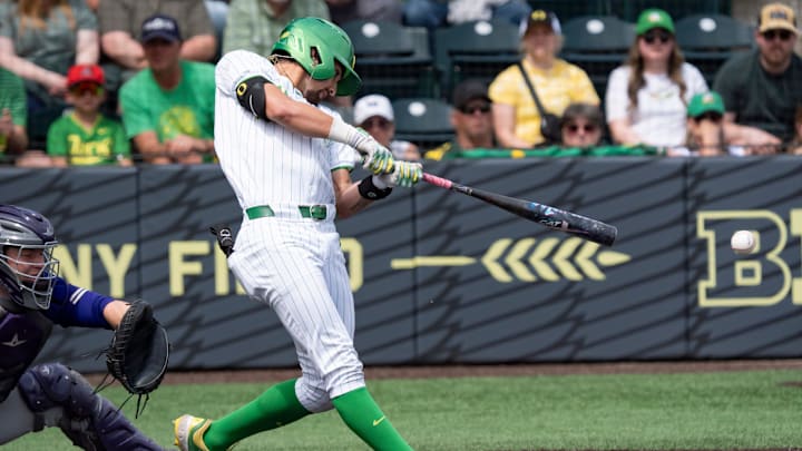 Carter Garate crushed a pair of home runs and drove in five as Oregon drummed Iowa 13-4 for a series sweep and at least a share of the Big Ten title.