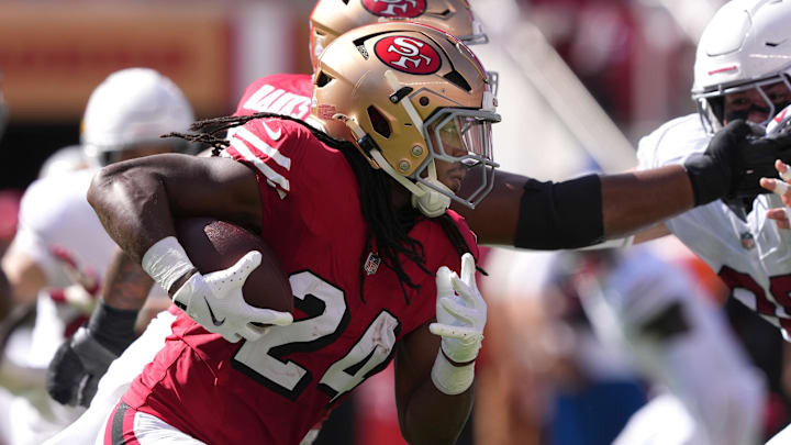 Oct 6, 2024; Santa Clara, California, USA; San Francisco 49ers running back Jordan Mason (24) carries the ball against the Arizona Cardinals during the second quarter at Levi's Stadium. Mandatory Credit: Darren Yamashita-Imagn Images Oct 6, 2024; Santa Clara, California, USA; San Francisco 49ers running back Jordan Mason (24) carries the ball against the Arizona Cardinals during the second quarter at Levi's Stadium. Mandatory Credit: Darren Yamashita-Imagn Images