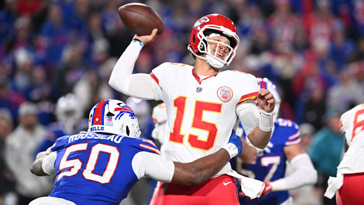 Kansas City Chiefs quarterback Patrick Mahomes (15) is pressured by Buffalo Bills defensive end Greg Rousseau (50) in the second quarter at Highmark Stadium.