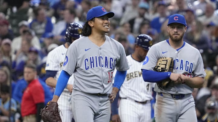 May 4, 2025; Milwaukee, Wisconsin, USA; Chicago Cubs pitcher Shota Imanaga (18) walks toward the mound to be checked out by a trainer after being injured against the Milwaukee Brewers in the sixth inning at American Family Field. Mandatory Credit: Michael McLoone-Imagn Images