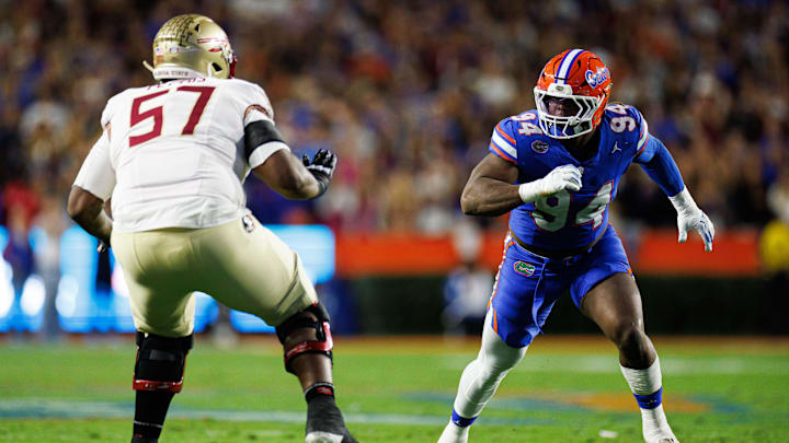 Nov 29, 2025; Gainesville, Florida, USA; Florida Gators defensive lineman Tyreak Sapp (94) rushes to tackle while Florida State Seminoles offensive lineman Micah Pettus (57) blocks during the first half at Ben Hill Griffin Stadium. Mandatory Credit: Matt Pendleton-Imagn Images