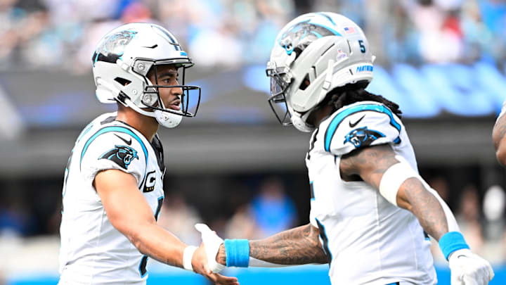 Carolina Panthers running back Rico Dowdle and quarterback Bryce Young