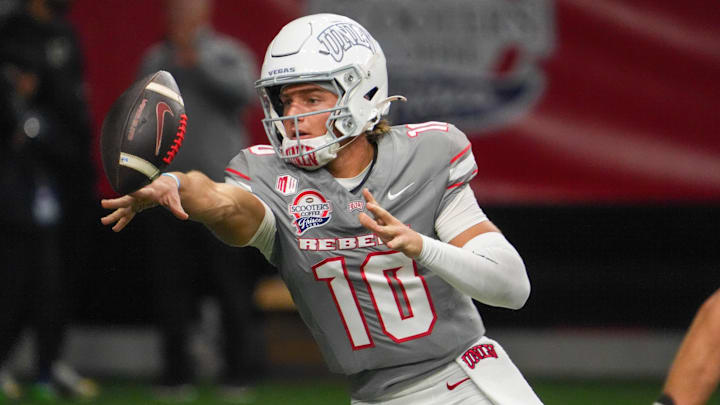 Dec 23, 2025; Frisco, TX, USA;  UNLV Rebels quarterback Anthony Colandrea (10) pitches the ball against the Ohio Bobcats during the second half at the Ford Center at The Star. Mandatory Credit: Raymond Carlin III-Imagn Images
