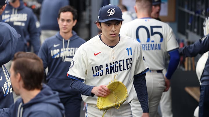 Apr 25, 2026; Los Angeles, California, USA; Los Angeles Dodgers starting pitcher Roki Sasaki (11) walks in the dugout after the first inning against the Chicago Cubs at Dodger Stadium. Mandatory Credit: Kiyoshi Mio-Imagn Images